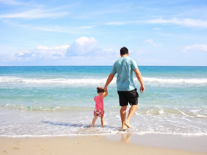 Vacationers - the beach on the spit Beelusus in Crimea is covered with beautiful small sand