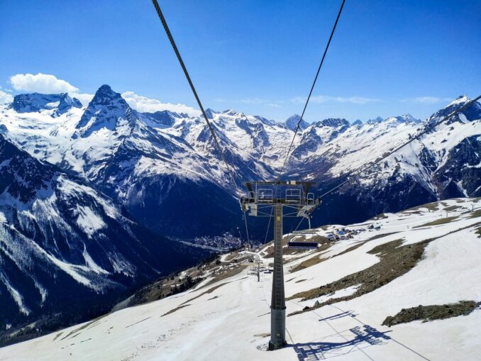 In the spring in the mountains of Dombay still lies snow