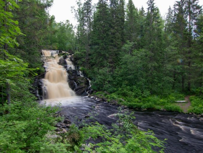 Kivach waterfall in July in Karelia is warm, but not very hot weather