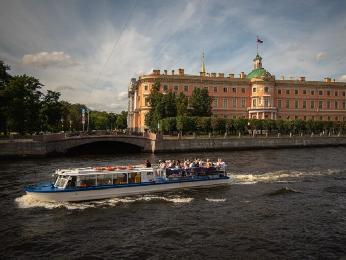 Cruise boat on Fontanka in St. Petersburg in the summer