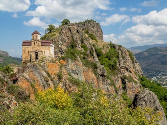 Shuaninsky temple must definitely look in September in Dombay