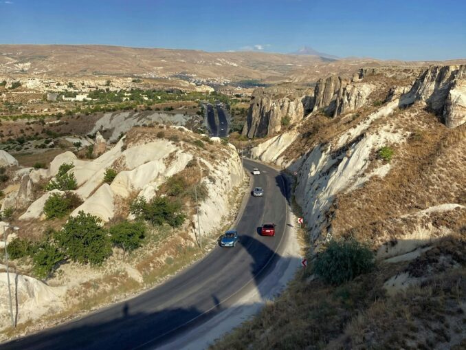 By car in Cappadocia, photo unsplash.com/@Beyza Yılmaz Road in Cappadocia