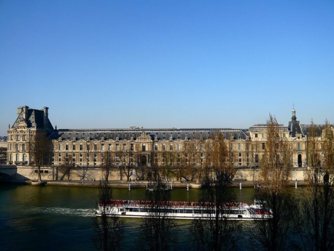 Pleasure boat on the Seine with the Louvre in the background